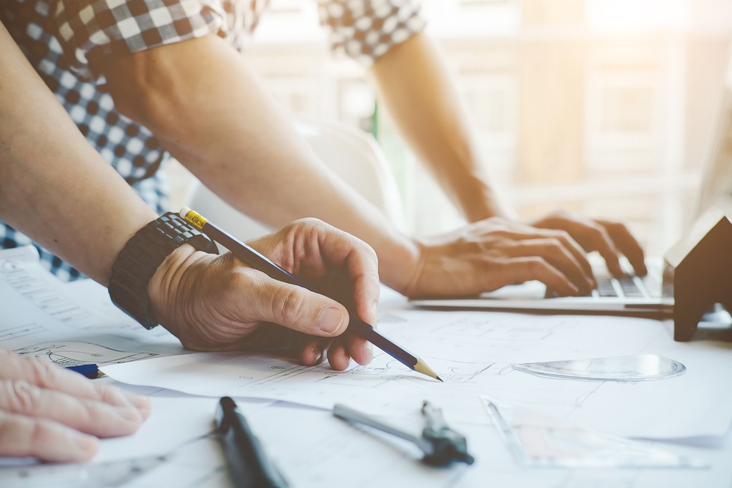 Stock image of two people making a building plan for their portable unfinished cabin in Oklahoma